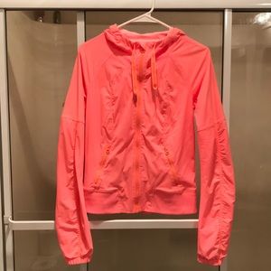 Lululemon “pop orange” street to studio jacket